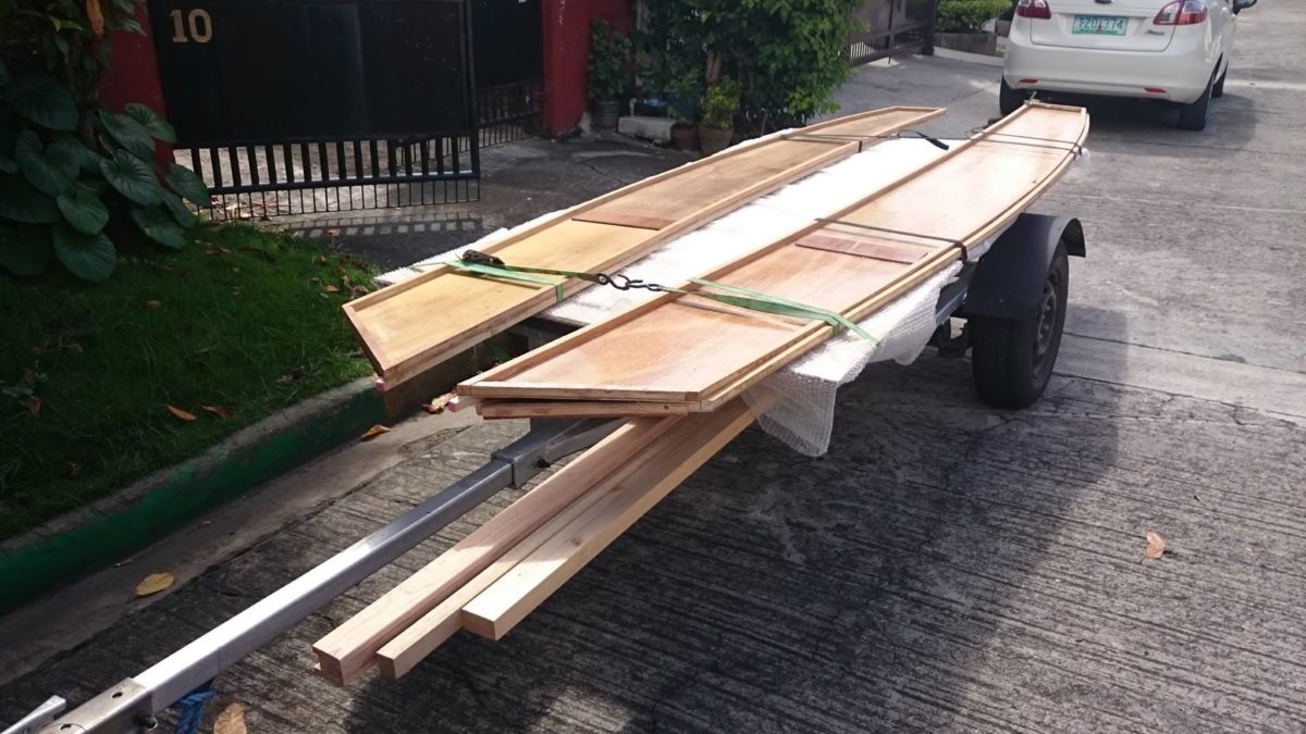 Precut plywood Oz Goose kit being picked up on trailer in the Philippines