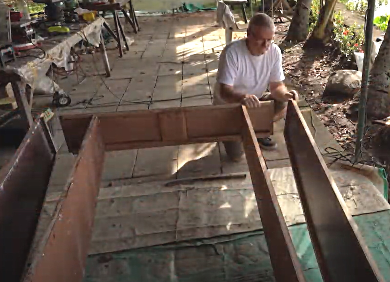 Fitting the side panel to the oz goose sailboat in the Philippines