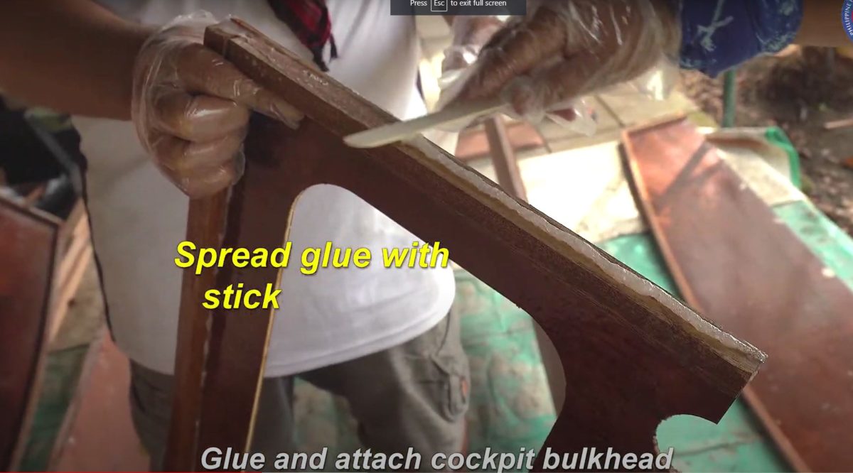 Epoxy gluing the plywood hull of hte Oz Goose Sailboat in the Philippines